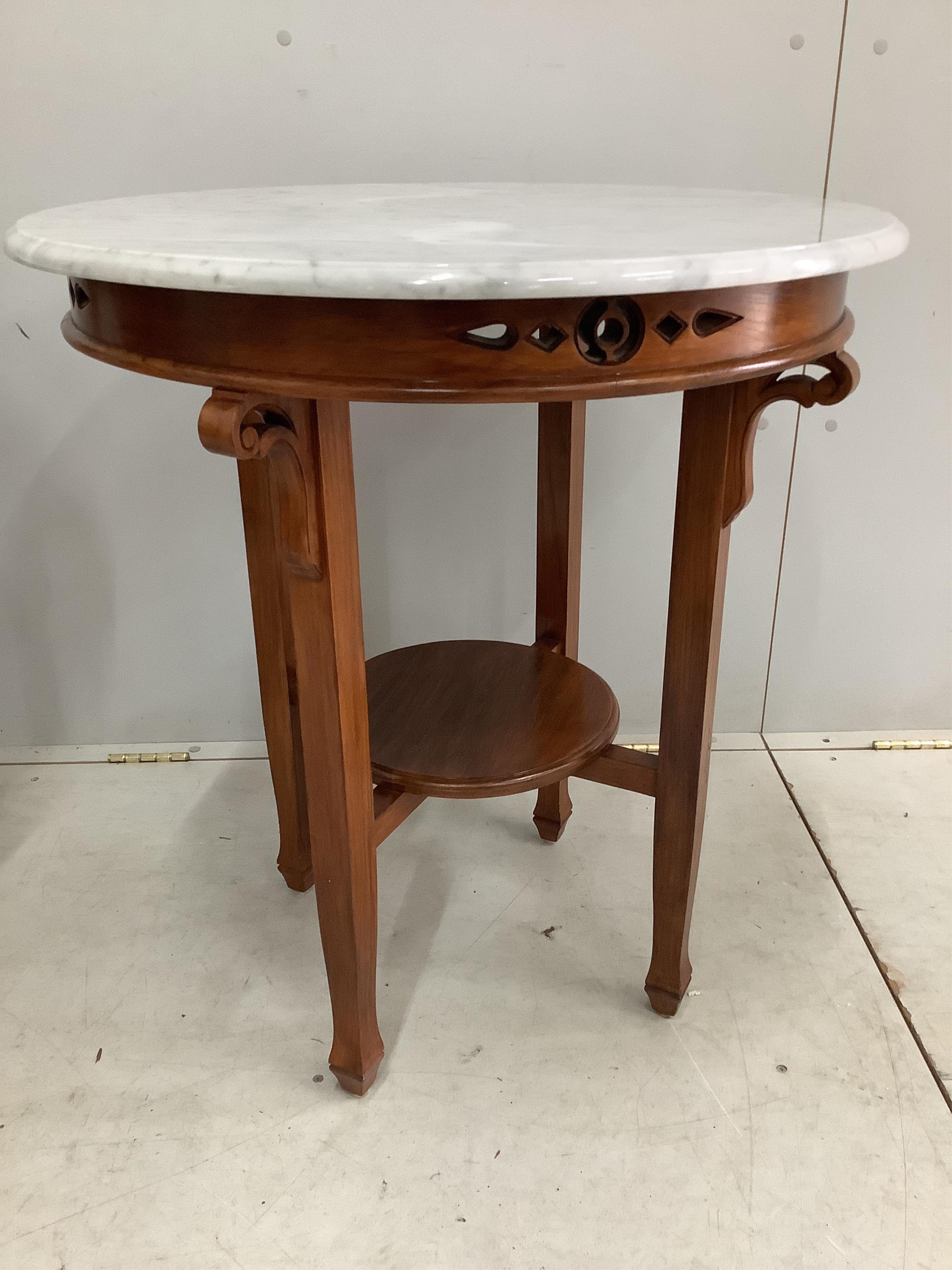 A pair of Chinese Straits circular marble topped two tier mahogany centre tables, diameter 69cm, height 75cm. Condition - good